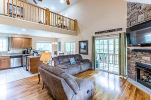 a living room with a couch and a fireplace at Full Stream Ahead in Whittier