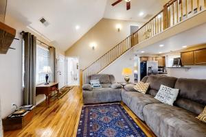 a living room with a couch and a piano at Full Stream Ahead in Whittier