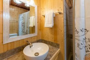 a bathroom with a sink and a mirror at The Outpost in Whittier
