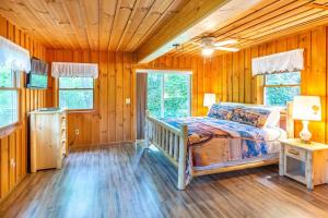 a bedroom with a bed in a wooden room at The Outpost in Whittier