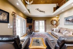 a living room with a couch and a table at Above the River in Sylva