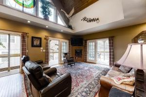 a living room with a couch and a table at Above the River in Sylva