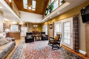 a living room with a couch and a table at Above the River in Sylva