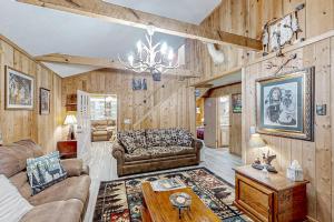 a living room with a couch and a table at The Little Dude Cabin in Franklin