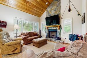 a living room filled with furniture and a fireplace at Simple blessings in Bryson City