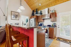 a kitchen with wooden cabinets and a counter top at Simple blessings in Bryson City
