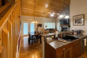 a kitchen with a counter top and a dining room at Simple blessings in Bryson City +19 photos