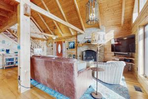 a living room with a couch and a tv at Slice of the Mountain in Franklin