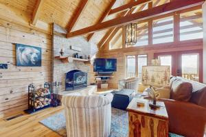 a living room with a couch and a fireplace at Slice of the Mountain in Franklin