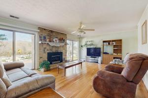 a living room with a couch and a fireplace at Shelba's Place in Sylva