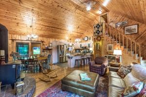 a living room and kitchen in a wooden house at The Treehouse in Franklin