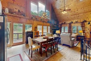 a kitchen and dining room with a table and chairs at Peak and Pond Retreat in Scaly Mountain +27 photos