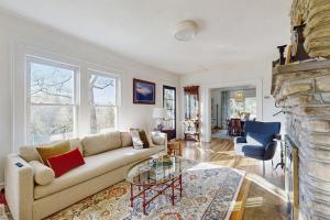 a living room with a couch and a fireplace at Huckleberry Hill in Waynesville