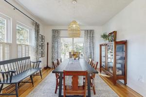 a dining room with a table and chairs at Huckleberry Hill in Waynesville