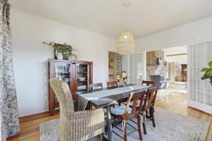 a dining room with a table and chairs at Huckleberry Hill in Waynesville