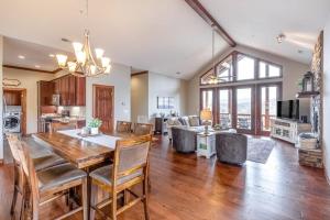 a dining room and living room with a table and chairs at Altitude with Gratitude in Whittier