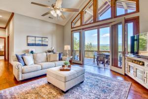 a living room with a couch and a tv at Altitude with Gratitude in Whittier