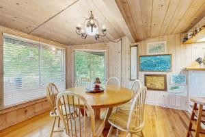 a dining room with a wooden table and chairs at Vista Heights Retreat in Bryson City