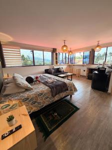 a large bedroom with a large bed and a desk at La Marteja in Salento