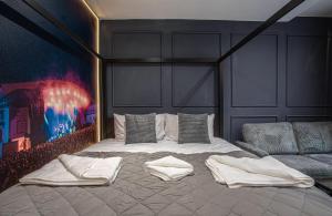 a bedroom with a bed and a couch at The Piece Hall Harmony Designer Studio - Superking in Halifax