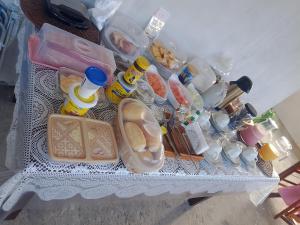 a refrigerator filled with lots of food and drinks at hospedaria Cantinho da Rosa in Santo Amaro