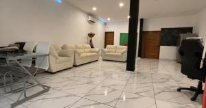 a living room with couches and a table at reforma tecoman colima mexico in Tecomán