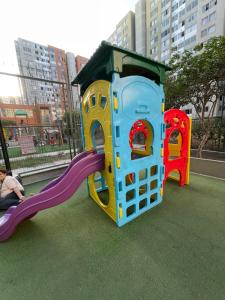 a childrens play equipment with a slide on a playground at Los Laureles -Executive Residence Departamento in Lima
