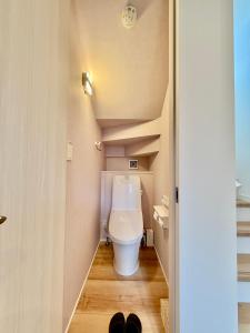 a bathroom with a toilet in a small room at BookHouse in Takasaki +19 photos