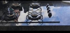 a glass table with a game controller on it at beach house in Pontal de Coruripe in Coruripe