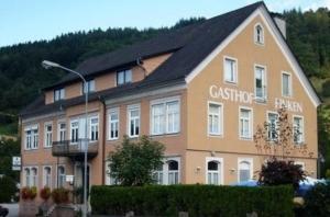 a building with a sign on the side of it at Gasthaus Finken in Oppenau
