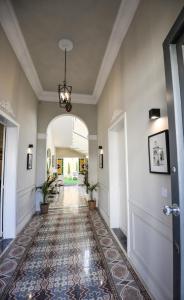 an ornate hallway with a door and a tile floor at Villa Dar Tfuliti in San Lawrenz +185 photos