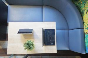 a computer keyboard sitting on top of a table at Feel Osaka Yu in Osaka