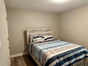 a bedroom with a bed with two pillows on it at Twin Oaks Haven in Murfreesboro