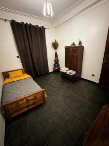 a bedroom with a bed and a christmas tree in it at Maison moderne & cosy in Constantine