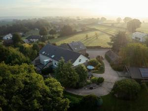 an aerial view of a house with a yard at Group Getaway in Amel in Amblève