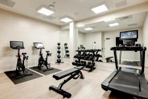 a gym with several exercise equipment in a room at The Bower Coronado in San Diego