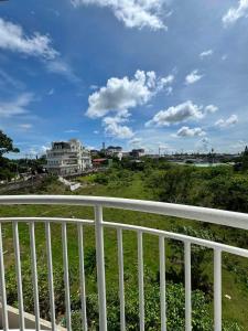 a view of a city from a balcony at Maldee's Place Tagaytay Prime Residences in Tagaytay