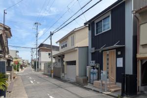an empty street with houses on the side at R STAY Nagoya Juocho in Nagoya