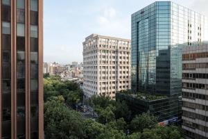 a view of two tall buildings in a city at amba Taipei Zhongshan in Taipei