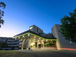 a building with lights on the side of it at Mercure Penrith in Penrith