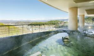 a pool of water in the middle of a building at Hilton Takayama Resort in Takayama