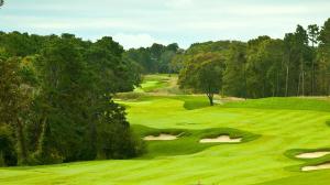 a view of a golf course with a green at New Cape Cod Condo Near Beaches in Brewster