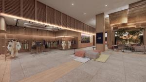 a lobby with a clothing store with tables and chairs at ASAI Gamuda Cove in Banting