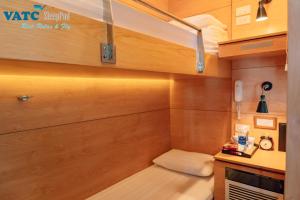 a small room with a bench in a kitchen at VATC Sleep Pod Terminal 1 in Noi Bai