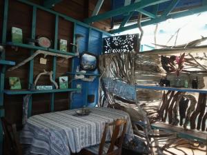 a table and chairs in a room with blue walls at Kismet Inn Semi Private in Hopkins +37 photos