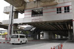 a white van parked in front of a building at 12 The Residence Hotel at Don Mueang Airport in Bangkok