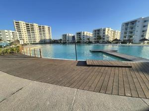 a large body of water in a city with buildings at Mazablue, alberca más grande de México in Mazatlán