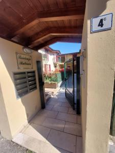 a walkway to the entrance of a building at Lake Iseo Apartment - Taxo4 in Paratico