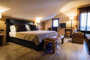Postel nebo postele na pokoji v ubytování Hotel Alù Mountain Design