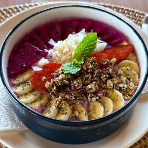 a bowl of food on a plate with fruit at Giri Rose Boutique Hotel in Kuta Lombok